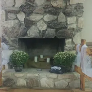 Clubhouse fireplace decorated for wedding