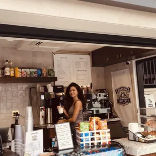 a woman behind the counter