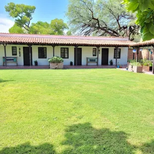 Rooms open up to a nicely groomed park like setting