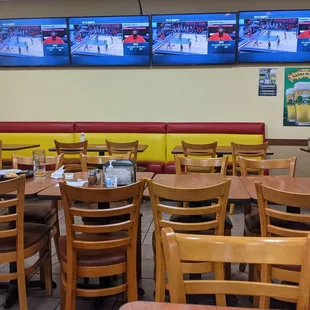 a dining area with tables and chairs