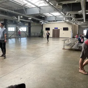 Upstairs center. Can view 3 courts on each side from the top