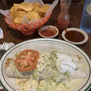 Chicken California burrito with regular and spicy salsa and chips