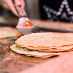  person making tortillas