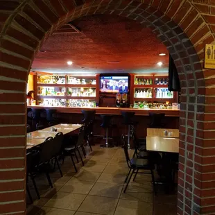 a view of a bar through a doorway