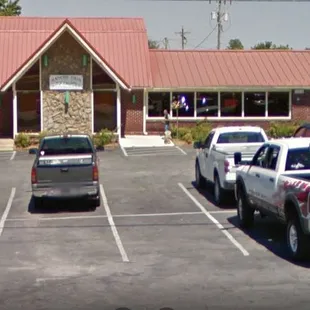 a parking lot with cars parked in it