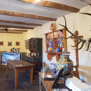 a dining room with antlers on the wall