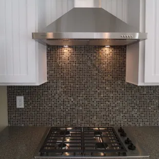 a kitchen with a range hood