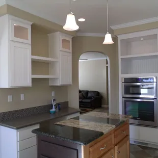 a kitchen with granite countertops