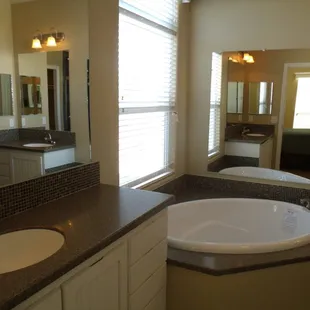 a large bathroom with a jacuzzi tub