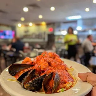 a person holding a plate of food