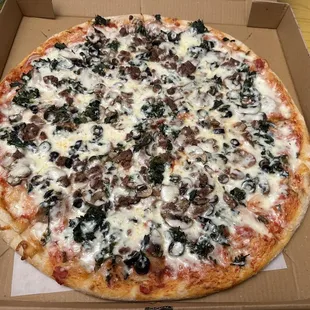 Large pie with Meatball, Sausage, Spinach, Black Olives and Mushroom and Extra Cheese.