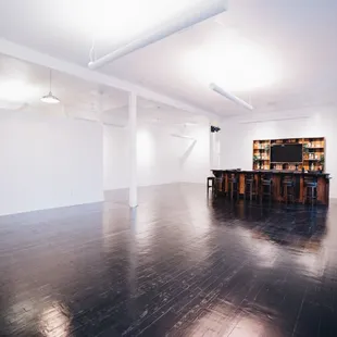 The light bounces beautifully off the white walls and dark wood floors