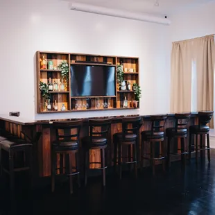 Our beautiful wood, handcrafted bar. You can have a bartender set up here easily.