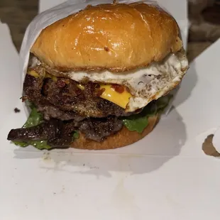 a burger with an egg on it