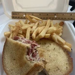 Hot Ruben with fries (ruler for scale)