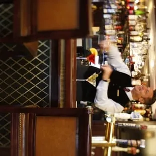 a bartender behind the bar