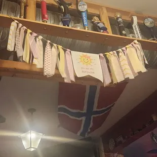 a bunch of cards hanging from the ceiling