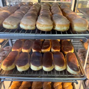 a variety of doughnuts in a display case