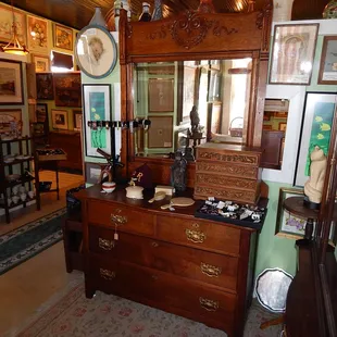 Antique oak four-drawer dresser with beveled mirror