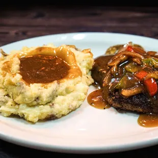 steak with gravy and mashed potatoes