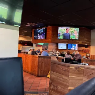 people sitting at the bar