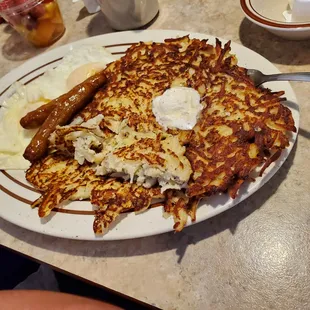 This potato pancake and sausages looks like it was plated by a bad interstate hwy diner chef.