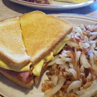 Breakfast sandwich with a side of hash browns