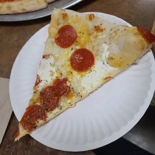 Don Vito slice. Wish the sauce went up to the edge but good flavors either way!