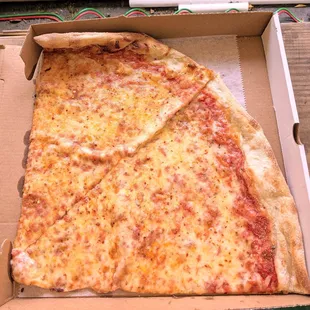 a slice of cheese pizza in a box