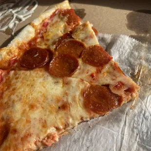 a slice of pepperoni pizza