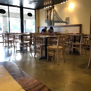 a dining area with tables and chairs