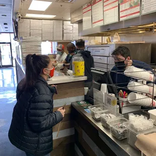 a man and a woman ordering food