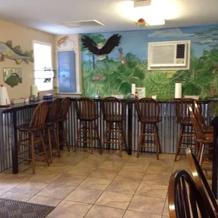 Interior of restaurant. It's very small with counter style seating. Most people eat outside.