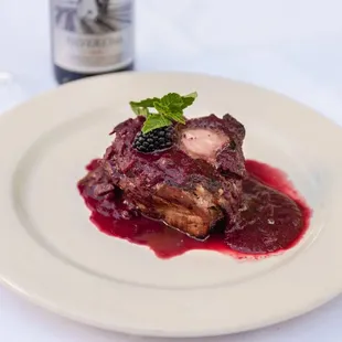 a plate of food and a bottle of wine
