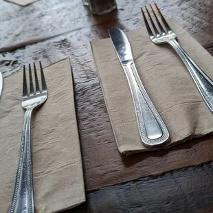 a fork, knife and napkin