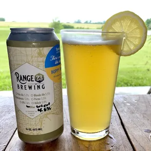 a glass of beer and a can of beer