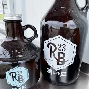 a growl of beer next to a growl of beer