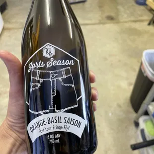 a person holding a bottle of wine