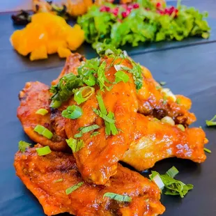 Tamarind BBQ Wings (D,N) Mango Habanero Chicken Tikka (N, G)