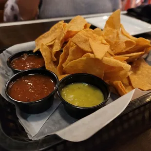 a tray of chips and condiments