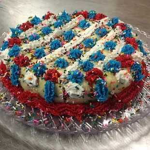 a cake with red, white, and blue sprinkles
