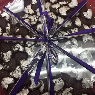 a chocolate cake wrapped in plastic