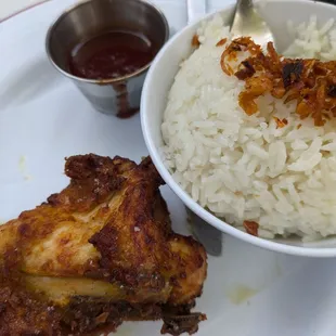 Quarter chicken plate w coconut rice and sauce (again ravaged lol)