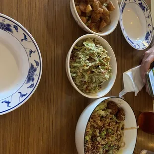 Fried potatoes, cabbage salad and tofu mush with noodles