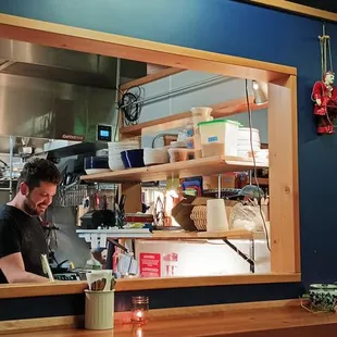 I really enjoy being able to watch kitchen activity from my table.