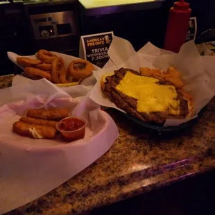 King t steak sandwich with cheese and the works, mozzarella sticks, cheese curds, and onion rings!
