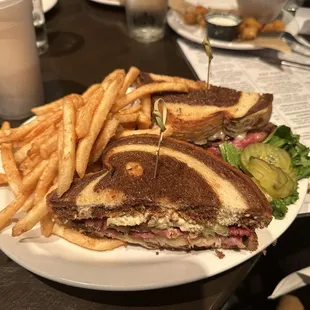 a sandwich and french fries on a plate