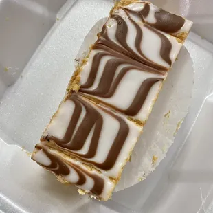 a piece of cake in a styrofoam container