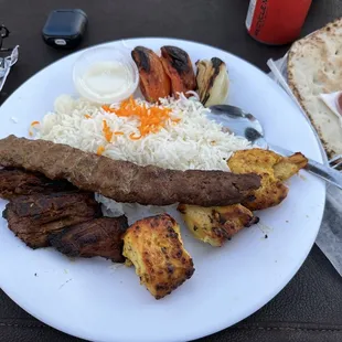 a plate of food with rice and meat