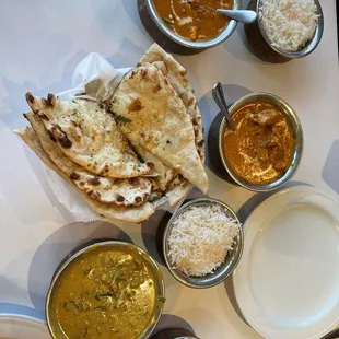 Paneer Tiki masala, butter chicken, chicken korma, and Garlic Naan